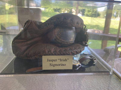 Jasper Signorino's baseball glove and wristwatch